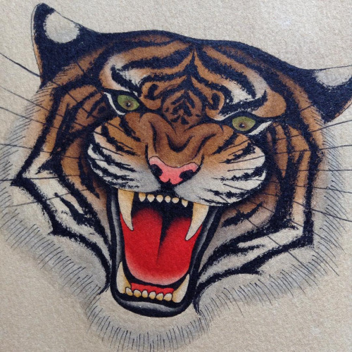Realistic colorful tiger muzzle tattoo design