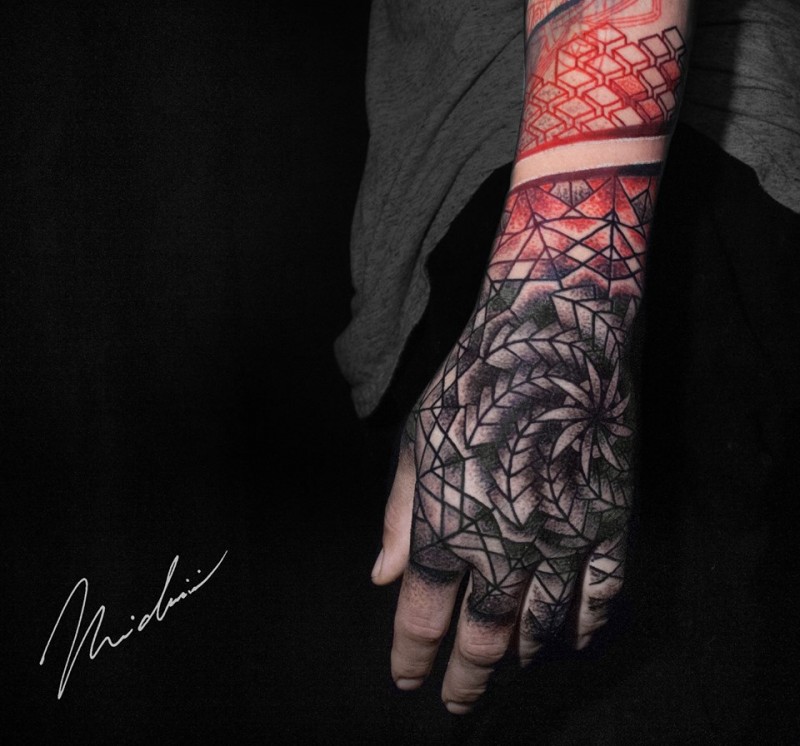 Red and gray geometric tattoo on wrist