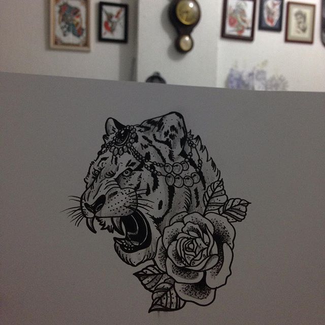 Roaring decorated tiger head with rose flower tattoo design