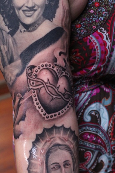Sacred heart american classic tattoo on sleeve