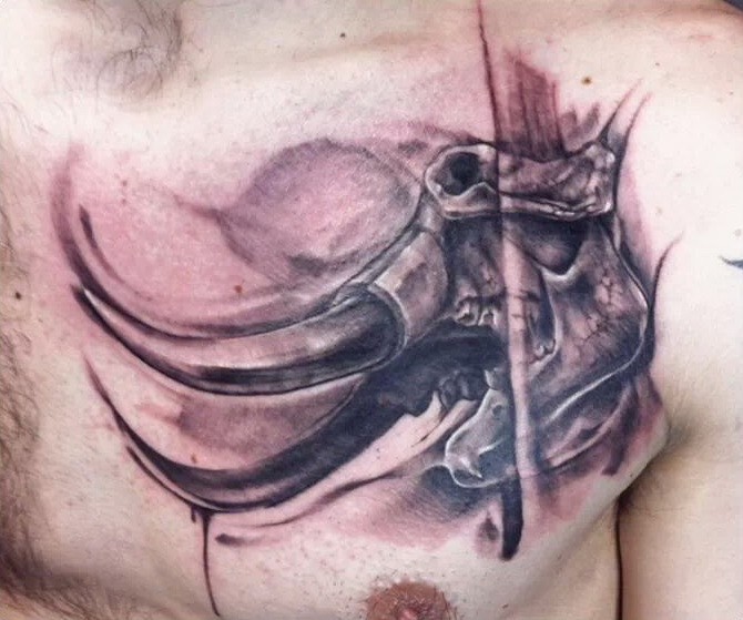 Scary black-and-white mammoth skull tattoo on chest