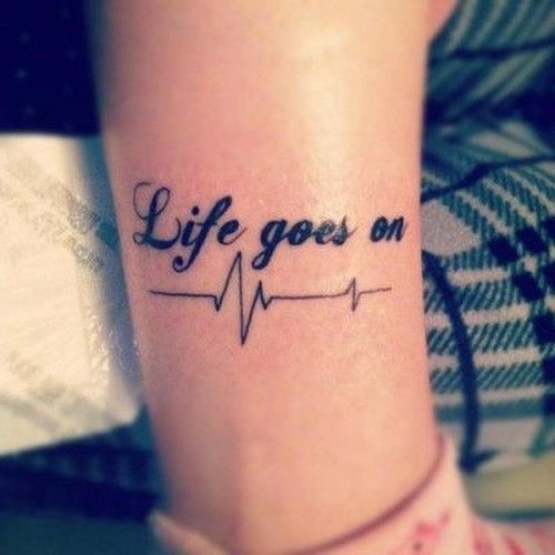 Short heartbeat life goes on quote tattoo on arm