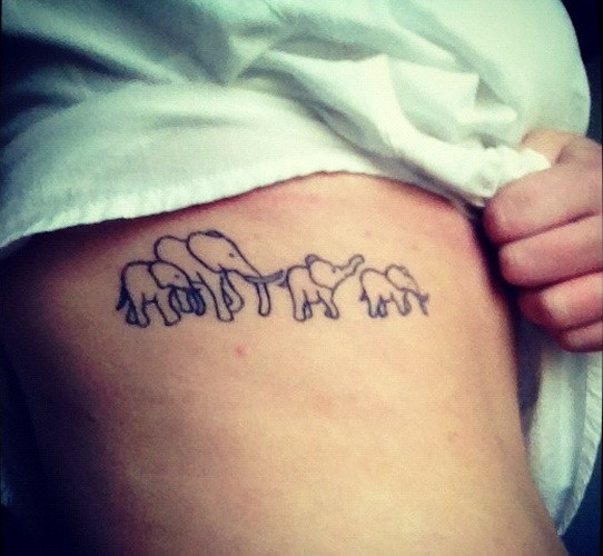Simple elephant family tattoo on rib-side