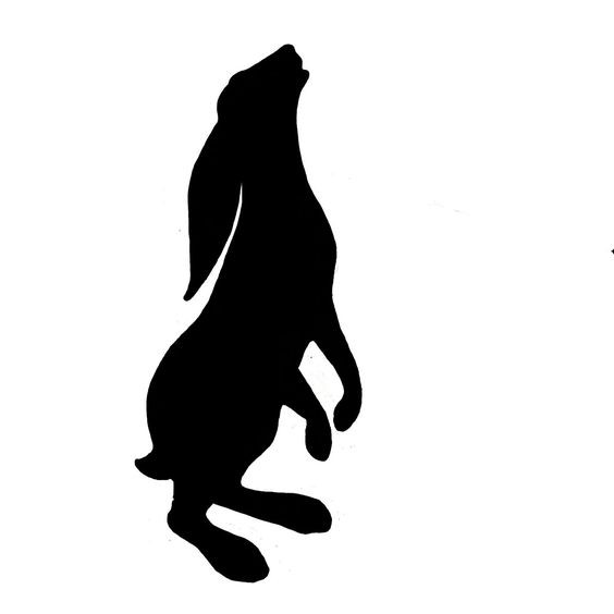 Simple full black howling hare tattoo design
