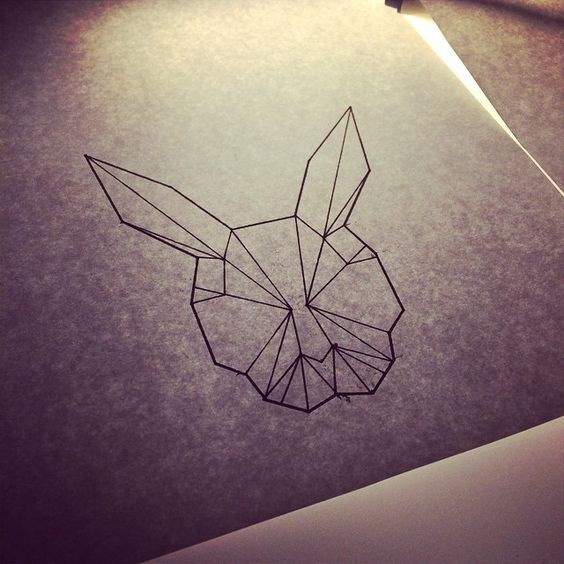 Simple geometric rabbit head tattoo design