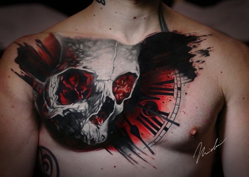 Skull and clock tattoo on chest