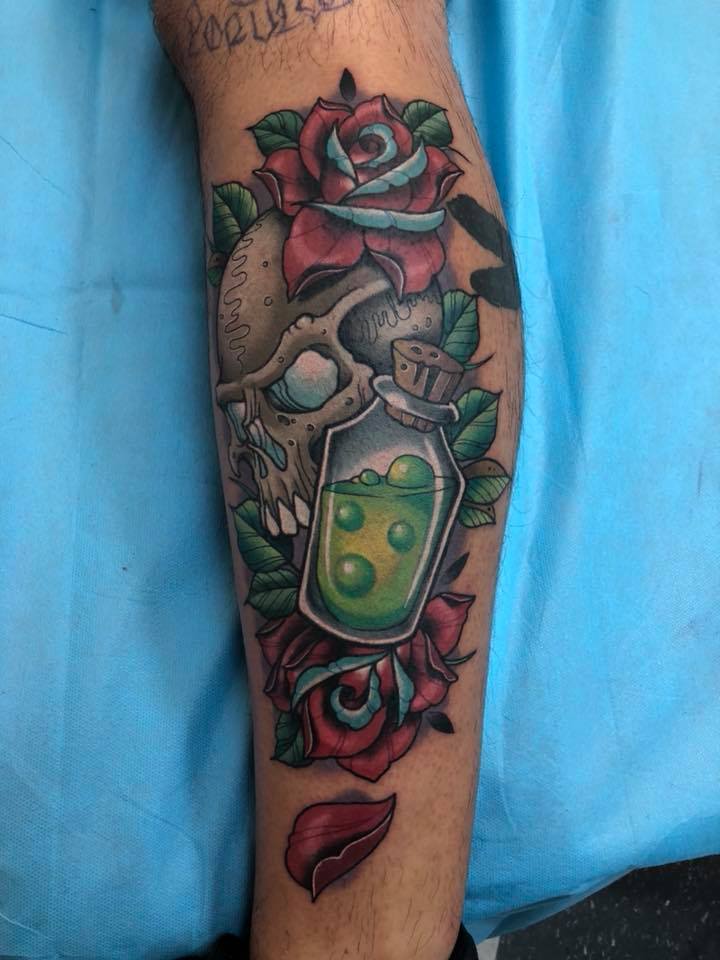 Skull roses and poison tattoo
