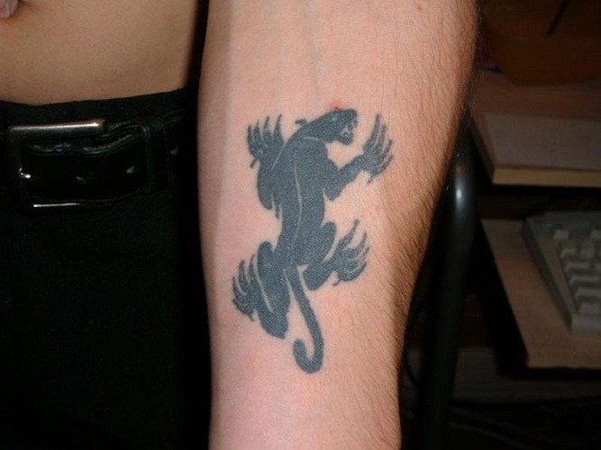 Small black panther tattoo on forearm