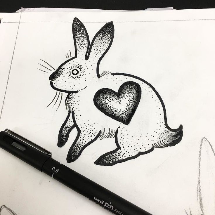 Small dotwork heart-printed rabbit tattoo design