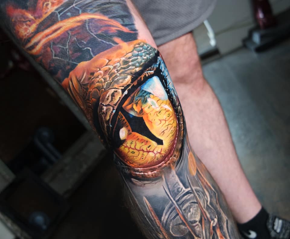 Smaug’s eye right on the knee tattoo