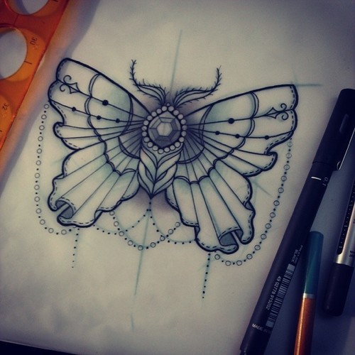 Splendid lace-decorated moth with gem body tattoo design