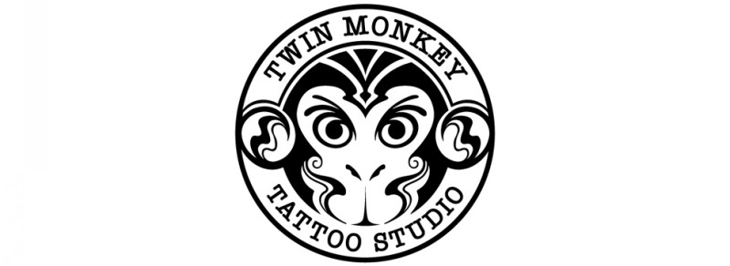 Static monkey coin with lettering tattoo design