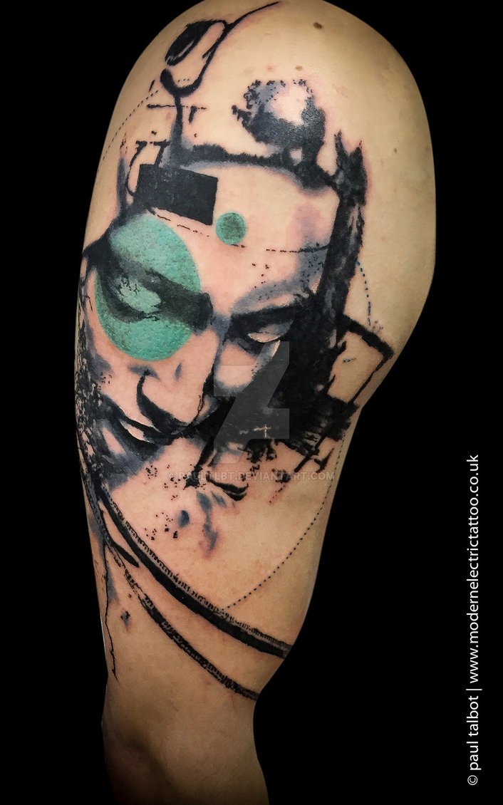 Statue like colored tattoo of woman head with circle