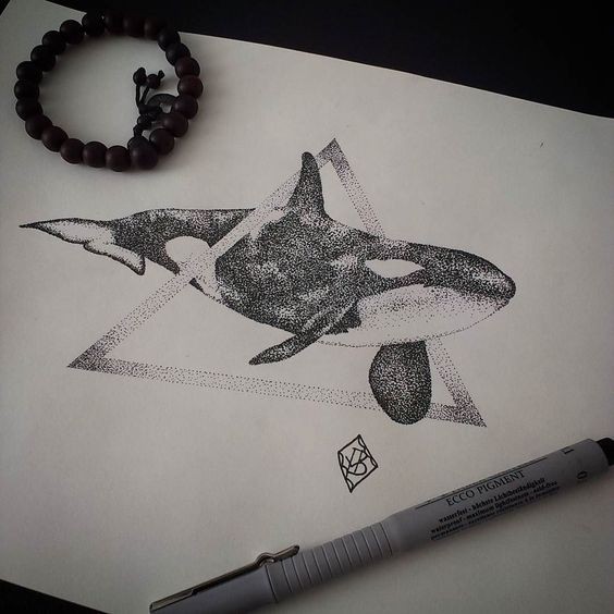 Super dorwork whale swimming through lagge triangle tattoo design