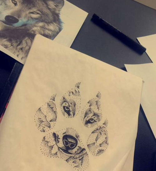 Sweet dotwork wolf reflection in a big paw tattoo design