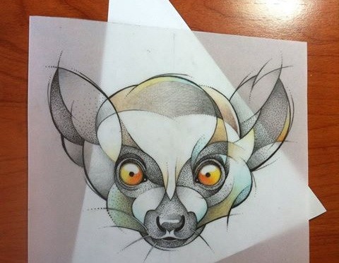 Sweet orange-eyed lemur head with dotwork effect tattoo design