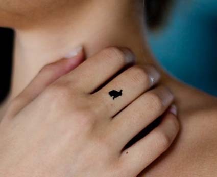 Sweet small black bunny tattoo for girls on finger