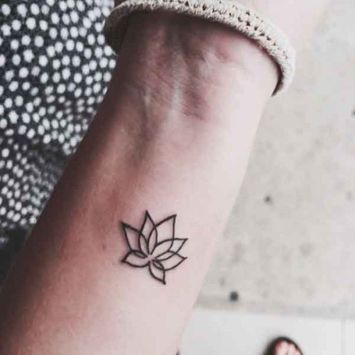 Tender small lotus flower tattoo on wrist