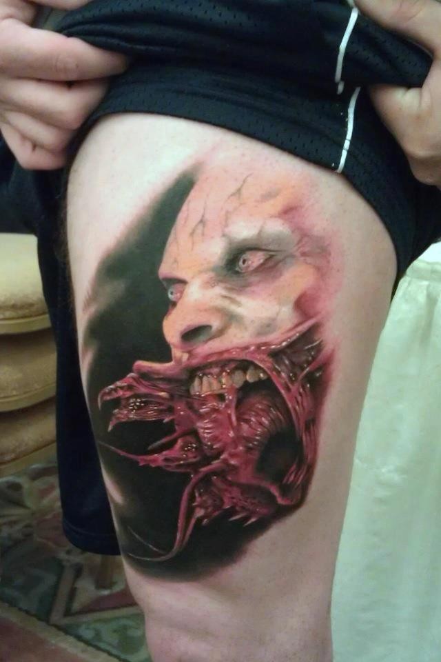 Terrifying colored horror thigh tattoo of evil vampire portrait