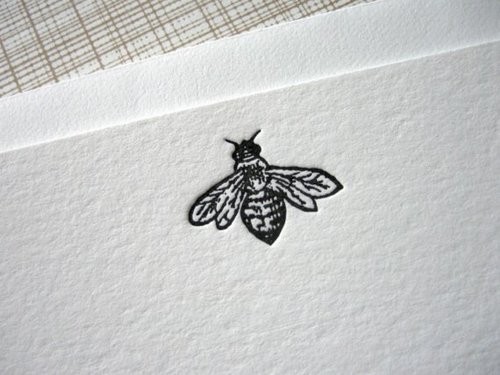 Tiny black-ink bee tattoo design
