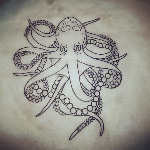 Tired black-and-white octopus with beaded tentacles tattoo design