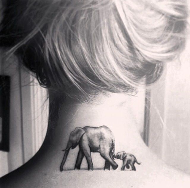 Traditional black-and-white elephant family tattoo on neck