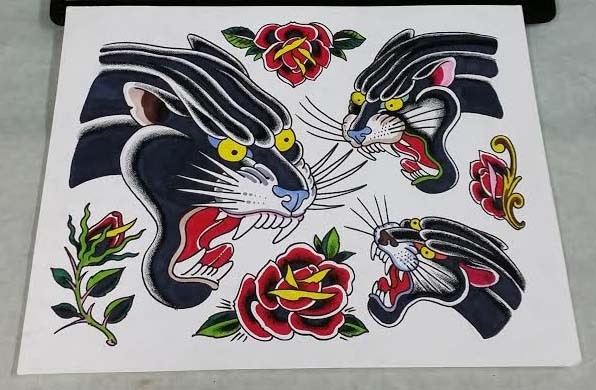 Traditional flash panther heads with flower decorations tattoo designs