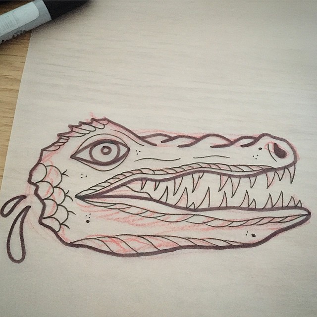 Traditional reptile head and two water drops tattoo design