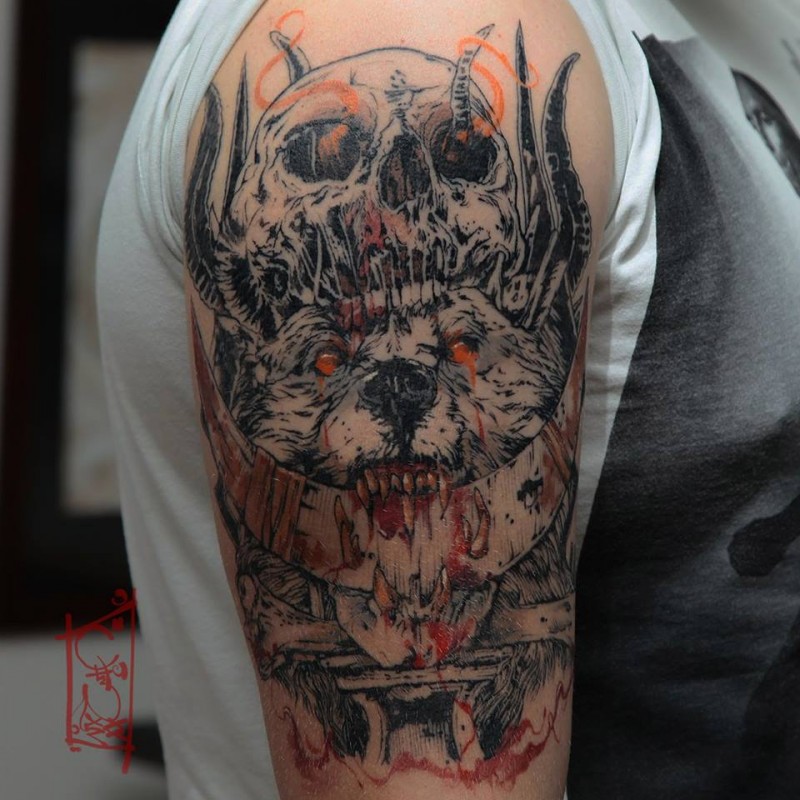 Trash skull and wolf tattoo on shoulder