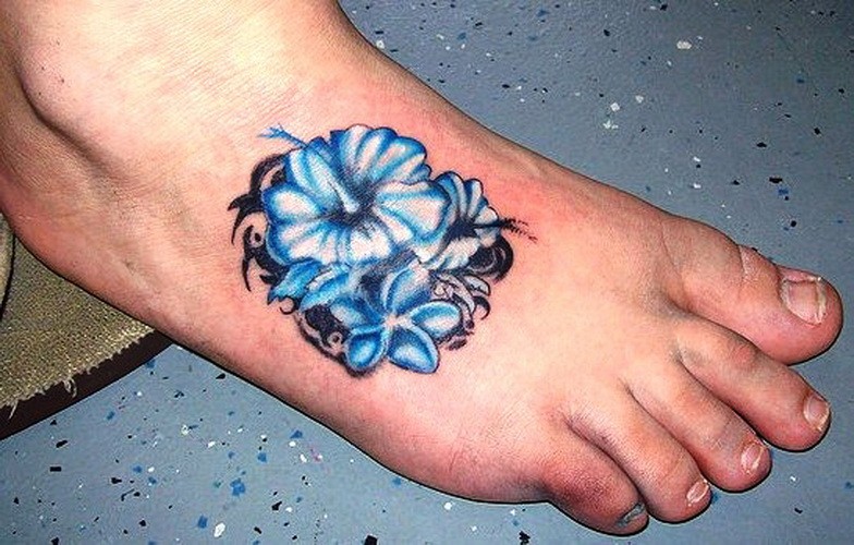 Tribal blue hawaiian hibiscus flower tattoo on foot