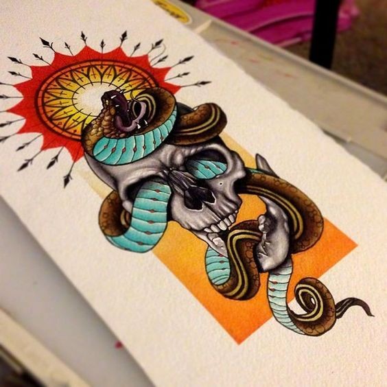 Turquoise-belly snake swiggling in skull and bright sun mandala tattoo design