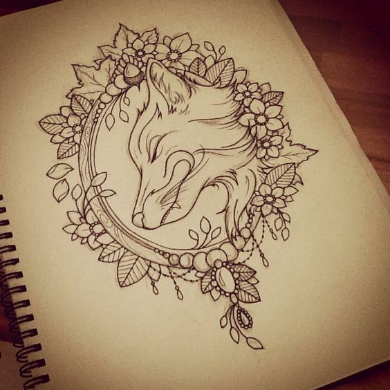 Uncolored fox portrait in floral frame tattoo design