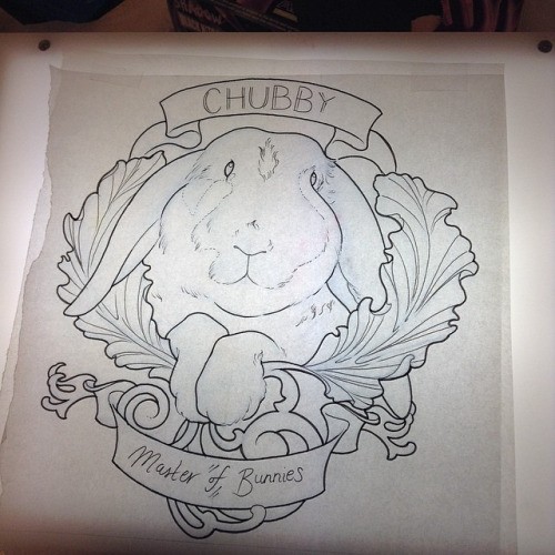 Uncolored rabbit with leaves and lettered ribbons tattoo design