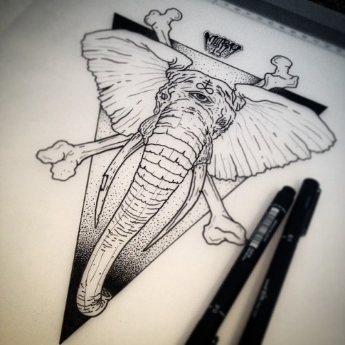 Uncolored third-eyed mammoth head with crosse bones on dotwork triangle background tattoo design