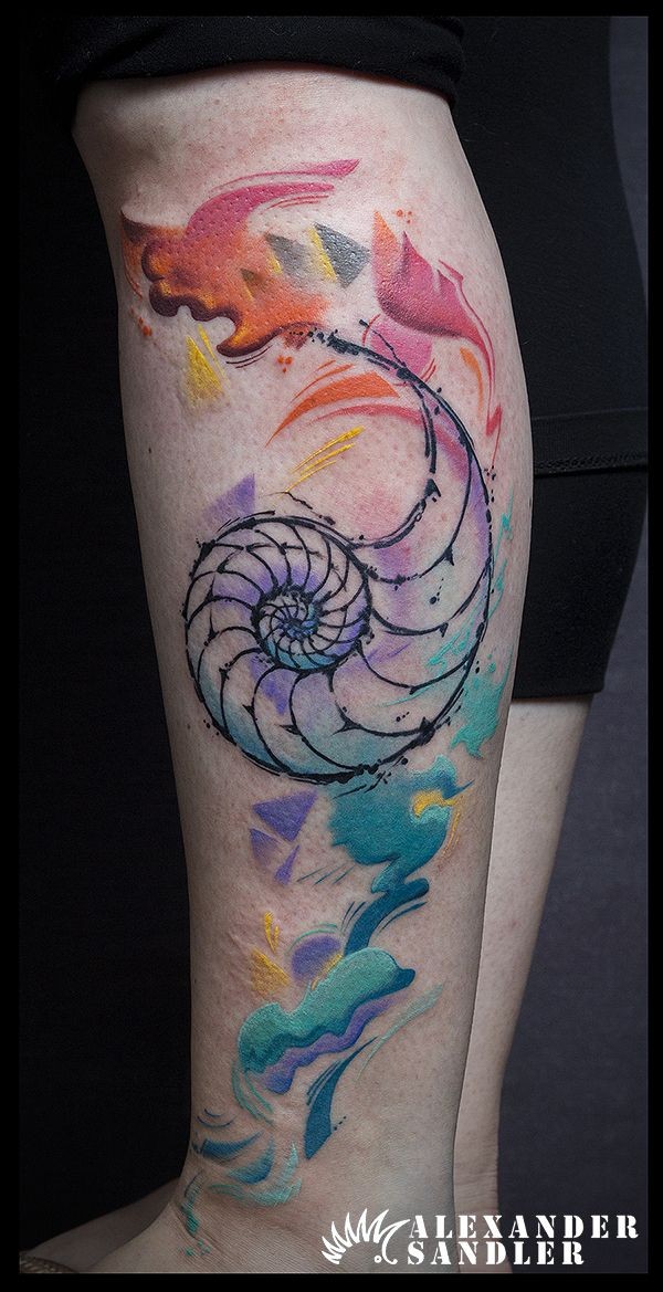 Unfinished multicolored leg tattoo of nautilus with flames
