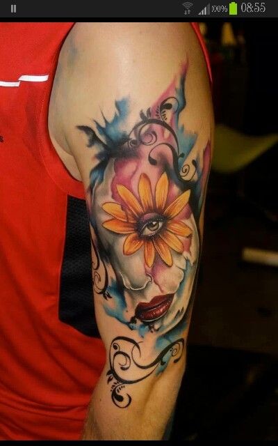 New school style colored shoulder tattoo of human face with flowers