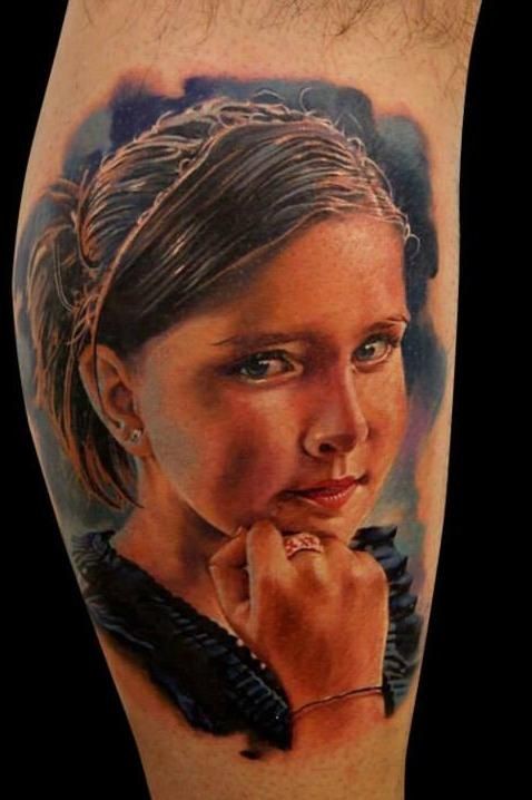Very realistic painted colored portrait tattoo of young girl