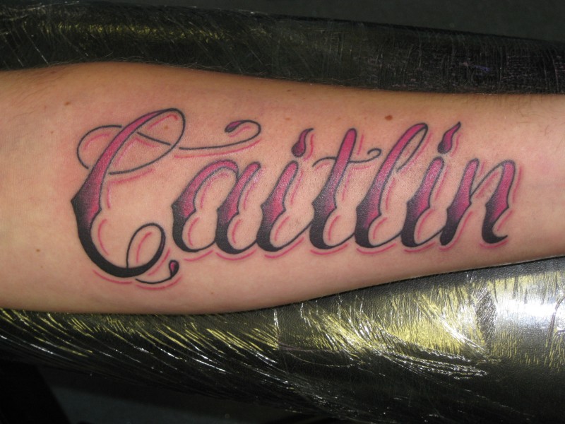 Violet name word tattoo on forearm