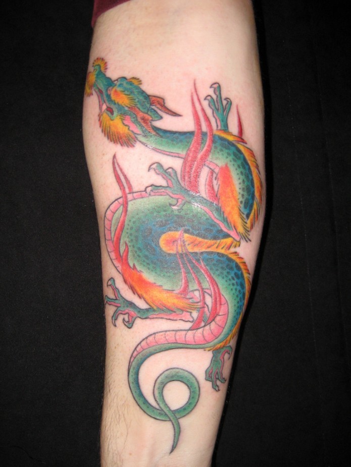 Vivid-colored chinese dragon tattoo on forearm