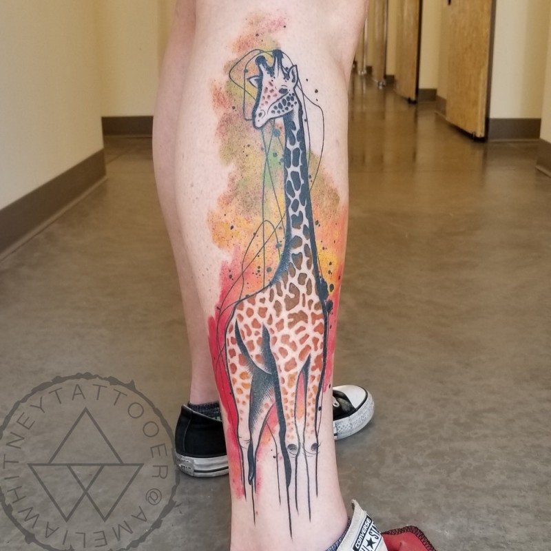 Watercolor giraffe tattoo on leg