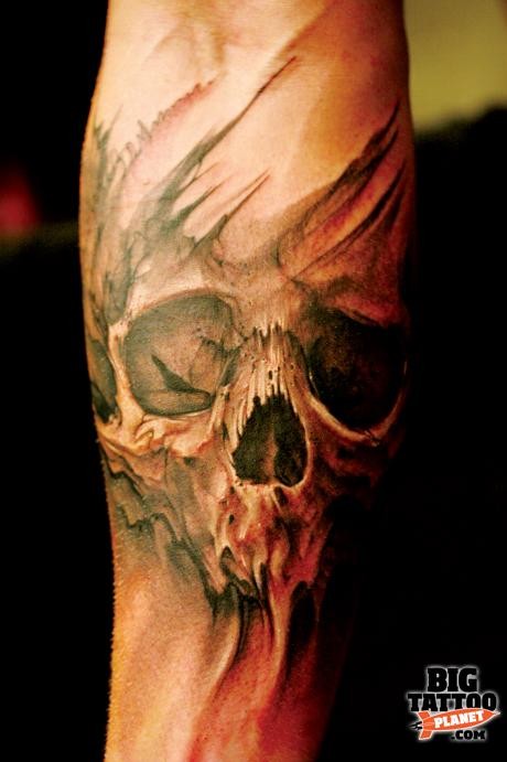 Watercolor skull tattoo on arm