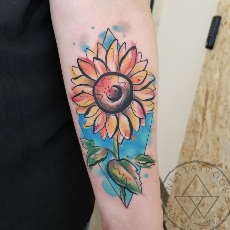 Watercolor sunflower tattoo on forearm
