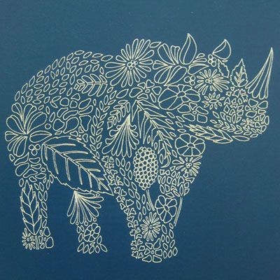 White-ink floral patterned rhino tattoo design