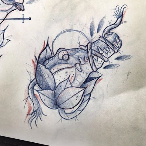 Winded reptile jaws with leaf elements tattoo design