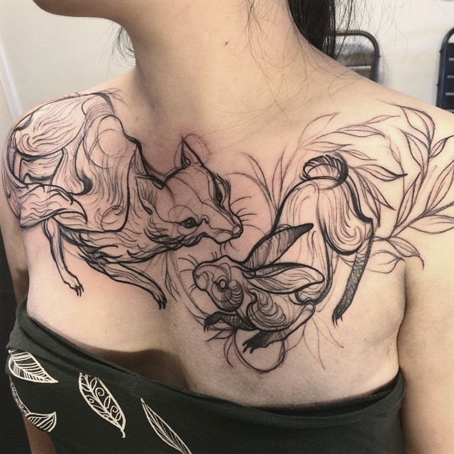 Wonderful black-ink hare and fox tattoo on chest