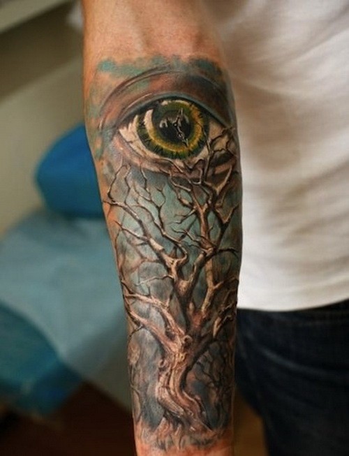 Wonderful colorful tree and eye on blue background tattoo sleeve on forearm