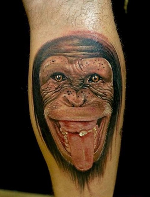Wonderful realistic chimpanzee showing a tongue tattoo on arm