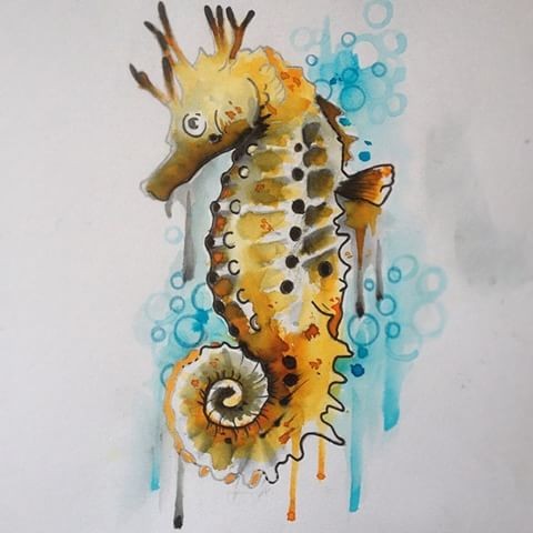 Yellow horned seahorse on blue smudged watercolor background tattoo design