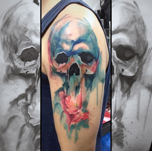 Abstract style big colored watercolor skull shoulder tattoo with mystical flower