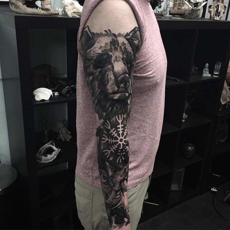 Abstract style black ink bear tattoo on sleeve combined with ornamental flower and owl
